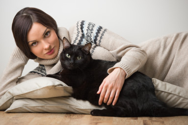 Pretty young woman with her cat