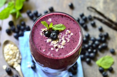 Blackberry and banana smoothie with oats and honey-healthy breakfast.
