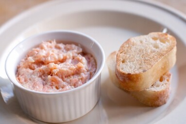 Pink salmon rillette. Pate of smoked fish in white plate