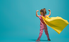 Little,Child,Playing,Superhero.,Kid,On,The,Background,Of,Bright