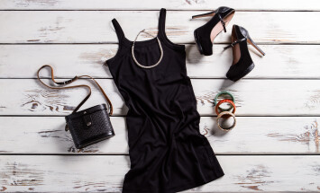 Black,Dress,,Shoes,And,Jewelry.,Black,Female,Outfit,On,Table.