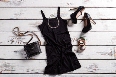 Black,Dress,,Shoes,And,Jewelry.,Black,Female,Outfit,On,Table.