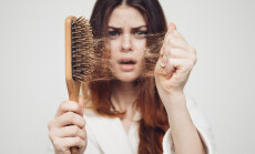 Girl,With,A,Comb,And,Problem,Hair,On,White,Background