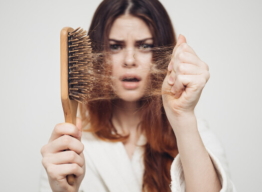 Girl,With,A,Comb,And,Problem,Hair,On,White,Background