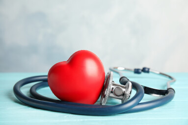 Stethoscope,And,Red,Heart,On,Wooden,Table.,Cardiology,Concept