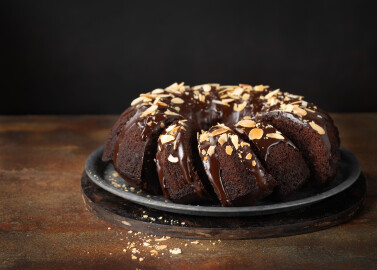 Delicious,Homemade,Chocolate,Bundt,Cake,With,Melted,Chocolate,And,Sliced