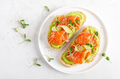 Open,Sandwiches,With,Salted,Salmon,,Guacamole,Avocado,And,Microgreens.,Seafood.