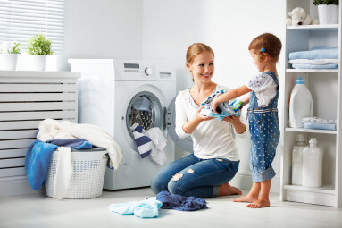 Family,Mother,And,Child,Girl,Little,Helper,In,Laundry,Room