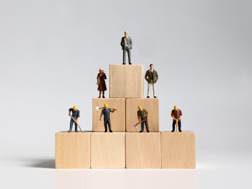 Wooden,Blocks,And,Miniature,People.,The,Concept,Of,Social,Stratification.