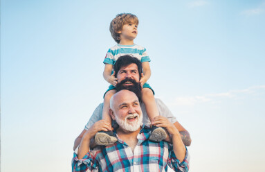 Men,Generation:,Grandfather,Father,And,Grandson,Are,Hugging,Looking,At