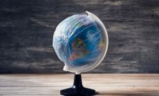 Closeup,Of,A,World,Globe,Wrapped,In,Plastic,,On,A