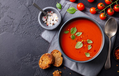 Tomato,Soup,With,Basil,In,A,Bowl.,Dark,Background.,Copy