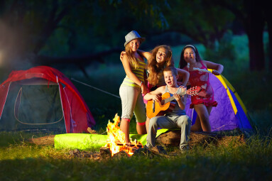 Happy,Teens,Together,Around,Camp,Fire