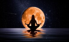 Woman,Meditating,In,Front,Of,The,Moon