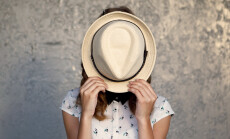 Young,Girl,With,Hat.,Hides,Her,Face.depression.photo,Tinted,And,Styled