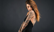 Intimate,Woman,Studio,Portrait,With,Long,Black,Dress,And,Tattoos