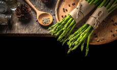 Bundle,Of,Fresh,Green,Asparagus,On,A,Rustic,Wooden,Table