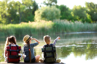 Little,Children,Sitting,On,Wooden,Pier.,Summer,Camp