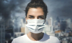 Air,Pollution,In,The,City.,Woman,Wearing,Face,Mask,For