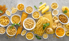 Pasta.,Various,Kinds,Of,Uncooked,Pasta,And,Noodles,Over,Stone