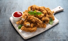 Fried,Chicken,Strips,With,Ketchup,On,White,Wooden,Board.,Fast