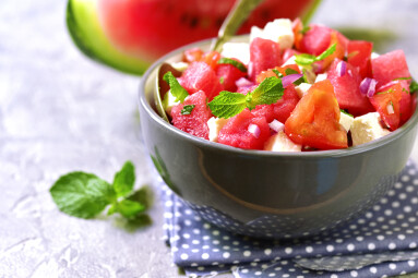 Watermelon,Salad,With,Feta,And,Mint,In,A,Grey,Bowl.