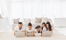 Large,Family,With,Gadgets.,Parents,And,Children,At,Laptops