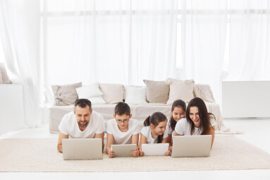 Large,Family,With,Gadgets.,Parents,And,Children,At,Laptops