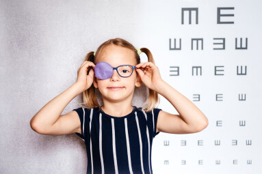 Happy,Little,Girl,Wearing,Glasses,And,Eye,Patch,Or,Occluder,