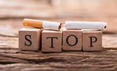 Close-up,Of,A,Cigarette,And,Wooden,Blocks,Showing,Stop,Word