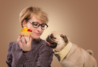 Pretty,Woman,Stopping,Her,Dog,From,Eating,Cake