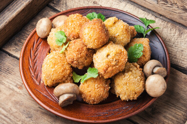 Breaded,Mushrooms,Or,Deep-fried,Mushrooms,In,A,Old,Wooden,Tray