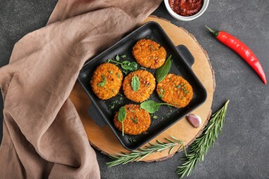 Frying,Pan,With,Tasty,Lentil,Cutlets,On,Dark,Background