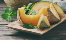 Fresh,Sweet,Orange,Melon,On,The,Wooden,Table,,Selective,Focus