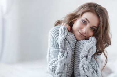 Woman,Indoor,Portrait.,Young,Beautiful,Woman,In,Warm,Knitted,Clothes