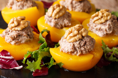 Delicious,Appetizer,Peaches,Stuffed,With,Tuna,And,Decorated,With,Walnuts