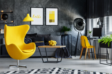 Designer's,Yellow,Chair,Next,To,Simple,Table,In,Living,Room