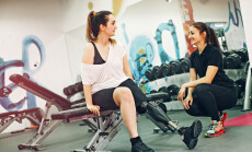 Disabled,Woman,Exercising,With,Personal,Trainer,In,The,Gym