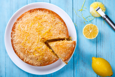 Cake,With,Lemon,And,Coconut.homemade,Cakes,On,A,Blue,Background.copy