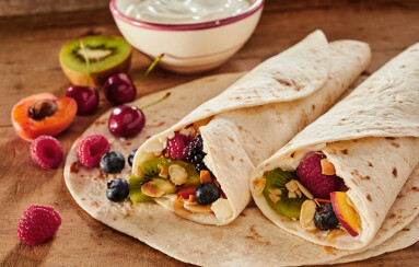 Two,Delicious,Healthy,Tropical,Fruit,Wraps,Layered,With,Whipped,Cream