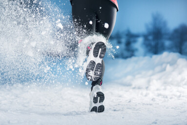Athlete,Woman,Is,Running,During,Winter,Training,Outside,In,Cold