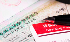 China,Visa,In,Passport,And,Boarding,Pass