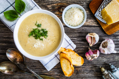 Cream,Garlic,And,Parmesan,Soup,On,Wooden,Table