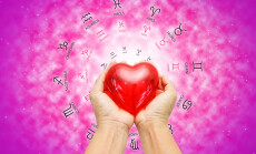 Hand,Holding,Red,Heart,On,Zodiac,Background,.