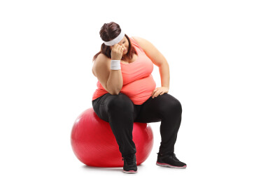 Sad,Overweight,Woman,Sitting,On,An,Exercise,Ball,Isolated,On