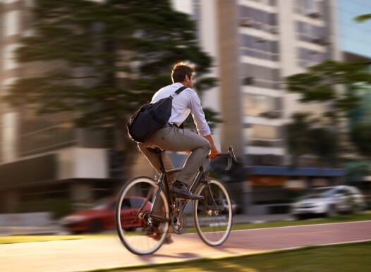 Fast,,Bicycle,And,Business,Man,In,City,For,Morning,,Commute