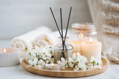 Aroma,Diffuser,,Burning,Candle,,Cherry,Blooming,Flowers,And,Perfume,On