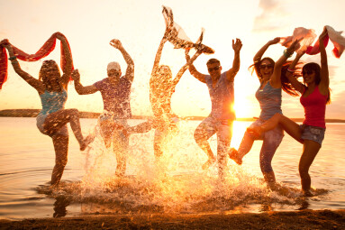 Large,Group,Of,Young,People,Enjoying,A,Beach,Party