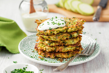 Zucchini,Fritters,,Vegetarian,Zucchini,Pancakes,,Served,With,Fresh,Herbs,And
