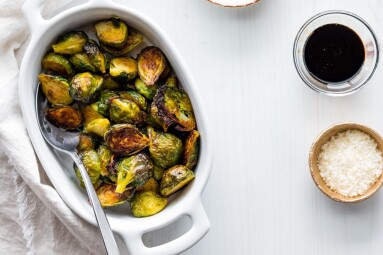 A,Dish,Of,Roasted,Brussel,Sprouts,With,Balsamic,Reduction,And